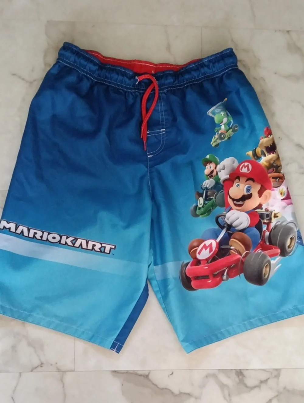 Boys Blue Graphic Swim Shorts with Red Drawstring